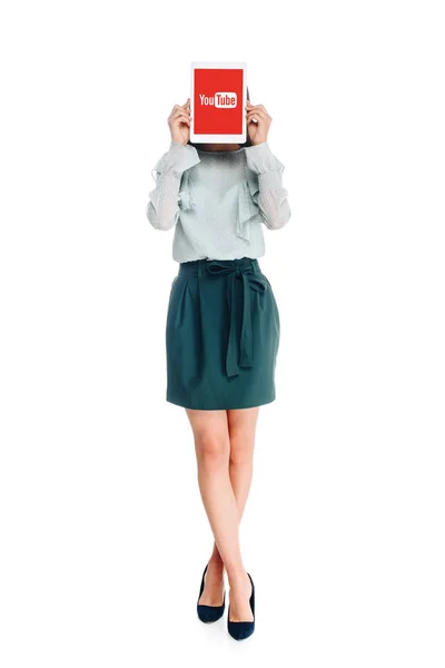 Obscured view of woman with tablet with youtube logo on screen isolated on white — Stock Photo