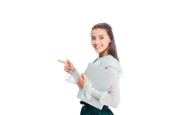 Side view of woman with laptop pointing away isolated on white — Stock Photo