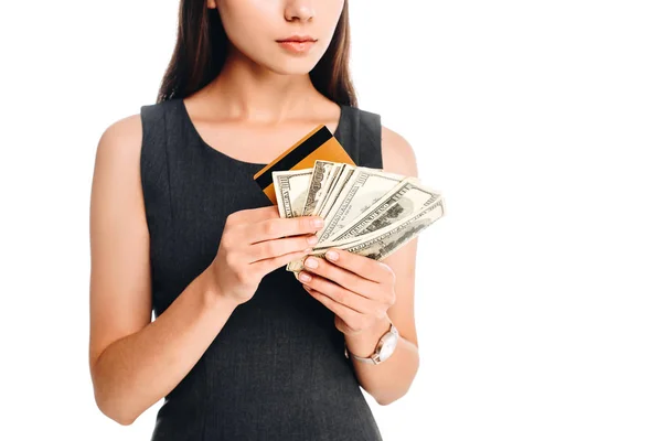 Cropped shot of woman in black dress with credit card and cash isolated on white — Stock Photo