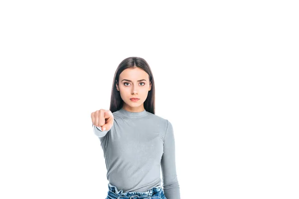 Portrait of beautiful serious woman pointing at camera isolated on white — Stock Photo