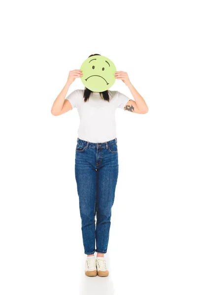 Woman holding sign with unhappy face expression isolated on white — Stock Photo