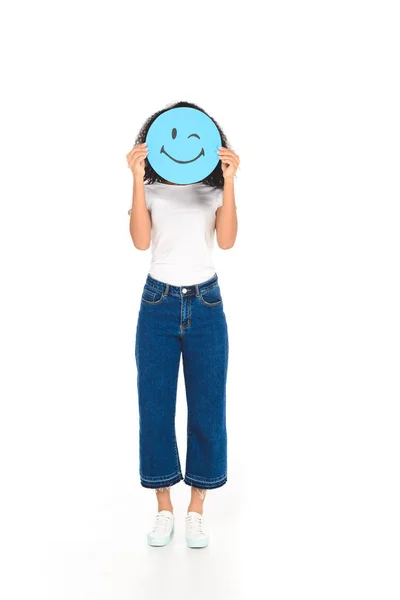 African american girl holding round sign with winking face expression isolated on white — Stock Photo