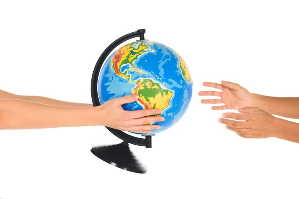 Cropped view of woman giving globe to african american girl isolated on white — Stock Photo