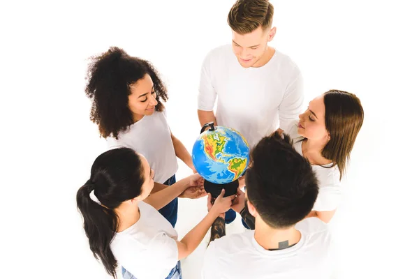 Overhead view of multiethnic group holding globe and standing in circle isolated on white — Stock Photo
