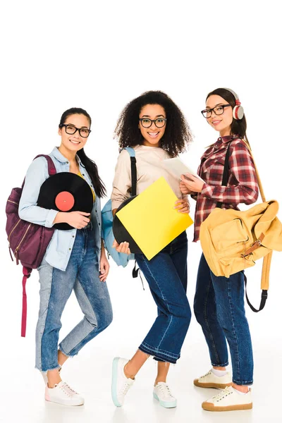 Beautiful girls in glasses with vinyl records  isolated on white — Stock Photo