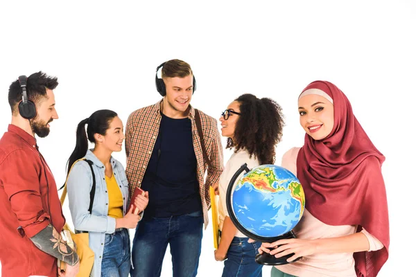 Beautiful muslim woman standing with globe near multiethnic group of people isolated on white — Stock Photo