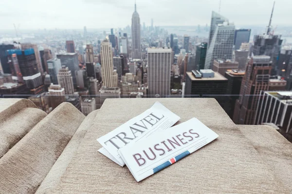 Close up view of travel and business newspapers and new york city view — Stock Photo