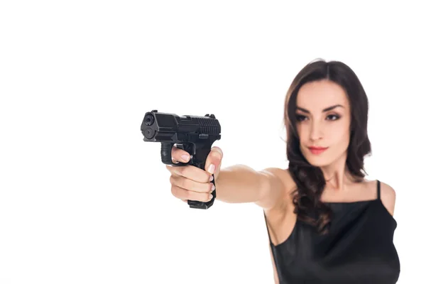 Beautiful elegant killer aiming with handgun isolated on white — Stock Photo