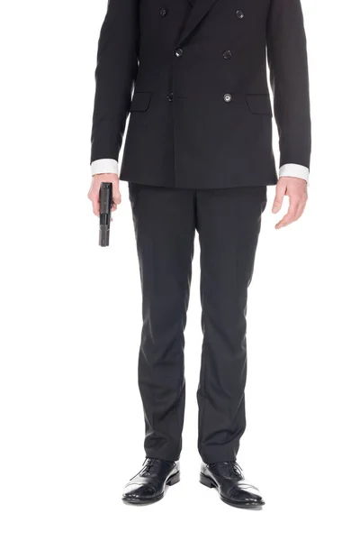 Cropped view of killer in black suit holding handgun, isolated on white — Stock Photo