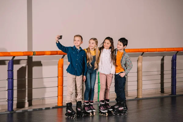 Roller skaters making selfie on skating rink — Stock Photo