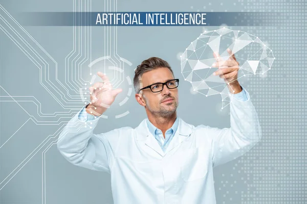 Handsome scientist in white coat and glasses moving brain interface, artificial intelligence concept — Stock Photo
