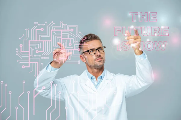 Handsome scientist in white coat and glasses moving brain interface with 