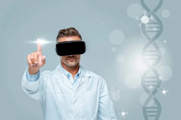 Scientist in virtual reality headset touching medical interface with dna isolated on grey, artificial intelligence concept — Stock Photo