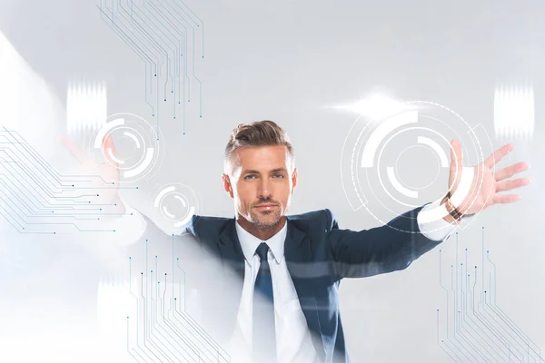 Hombre de negocios guapo sosteniendo tecnología de la innovación aislada en blanco, concepto de inteligencia artificial - foto de stock