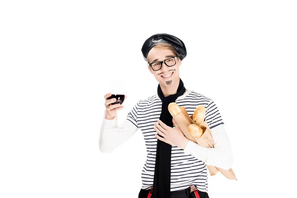 Handsome french man holding glass of wine and bagguettes isolated on white — Stock Photo