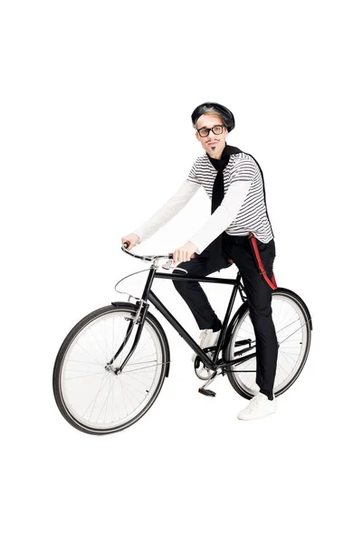 Happy french man in glasses riding bicycle isolated on white — Stock Photo