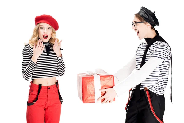 French man gifting present to attractive woman in beret isolated on white — Stock Photo