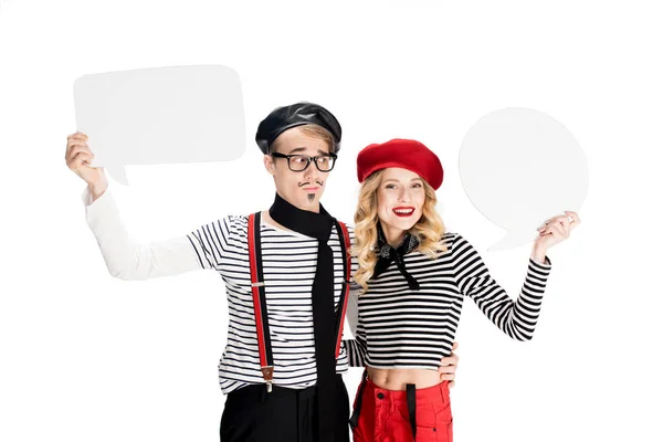 Happy french couple holding empty speech buubles isolated on white — Stock Photo