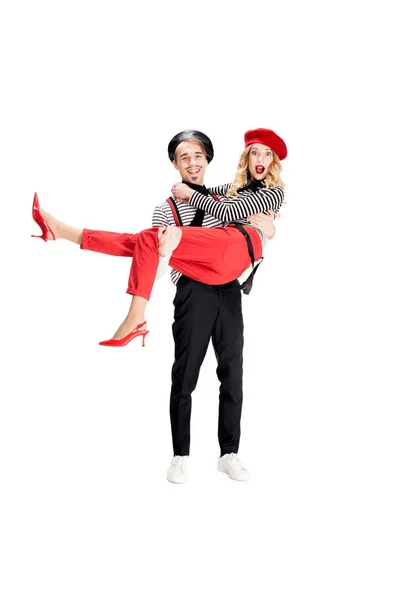 French man holding in arms attractive woman in red beret isolated on white — Stock Photo