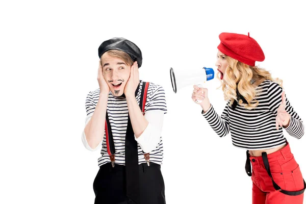 Angry french woman screaming in megaphone near boyfriend isolated on white — Stock Photo