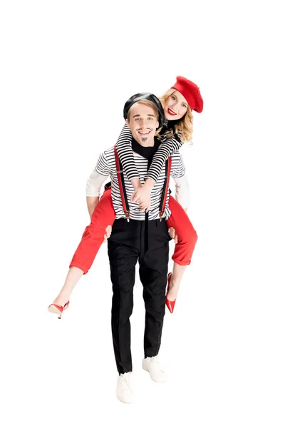 Cheerful french man holding in arms happy girlfriend in red beret isolated on white — Stock Photo