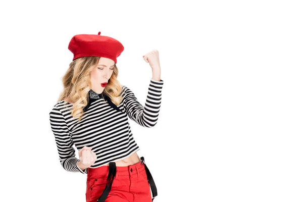 Excited woman in red beret smiling while celebrating winning isolated on white — Stock Photo