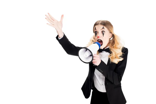 Angry female clown yelling in megaphone while standing in suit isolated on white — Stock Photo