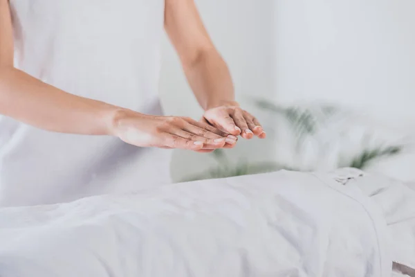 Partial view of reiki therapist practising palm healing session — Stock Photo