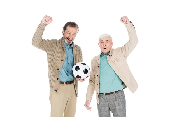Cheerful senior man holding football and celebrating victory with friend isolated on white — Stock Photo