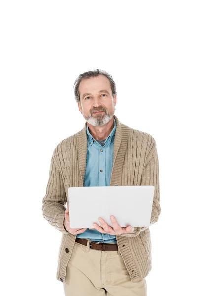 Retired man holding laptop isolated on white — Stock Photo