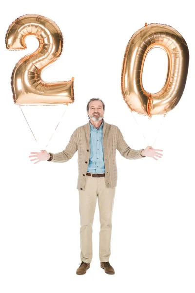 Smiling senior man holding balloons isolated on white — Stock Photo