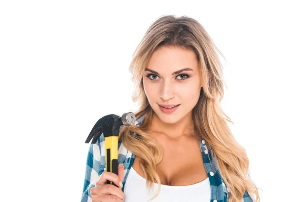Attractive blonde handy woman in blue shirt holding hammer isolated on white — Stock Photo