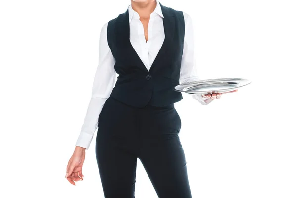 Cropped view of waitress in black uniform holding silver tray isolated on white — Stock Photo