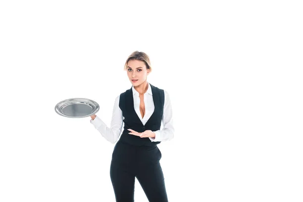 Blonde waitress in black uniform standing with tray isolated on white — Stock Photo