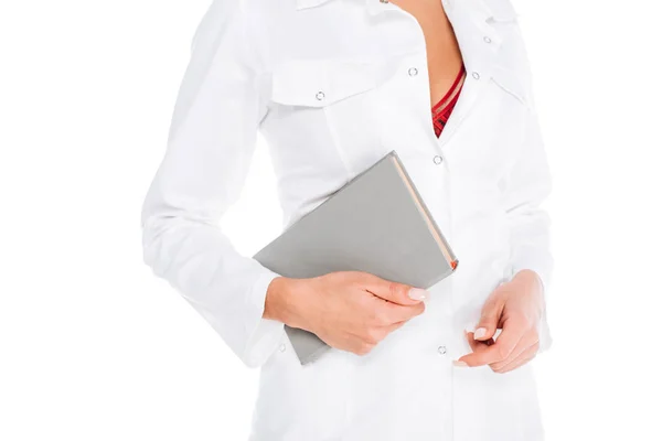Vista cortada de enfermeira em casaco e roupa interior vermelha com livro isolado em branco — Fotografia de Stock