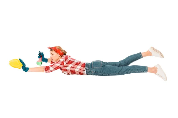 Floating girl in jeans and plaid shirt cleaning with rag and spray — Stock Photo