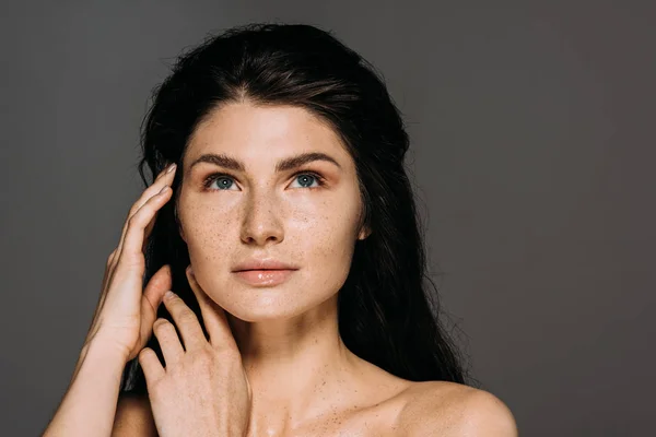 Beautiful naked girl with freckles on face isolated on grey — Stock Photo