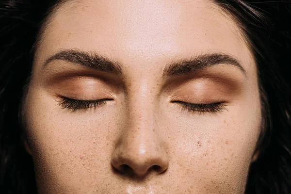 Close up view of girl with closed eyes and freckles on face — Stock Photo