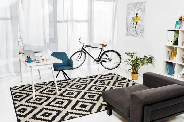 Home office with furniture and green plant in pot — Stock Photo