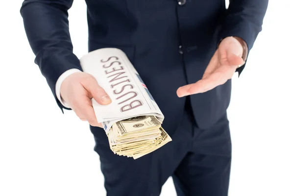 Vista recortada de empresario dando soborno en periódico de negocios aislado en blanco — Stock Photo