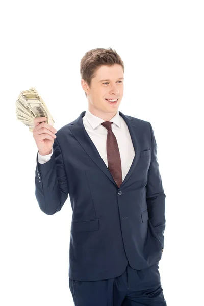 Handsome businessman holding dollar banknotes isolated on white — Stock Photo