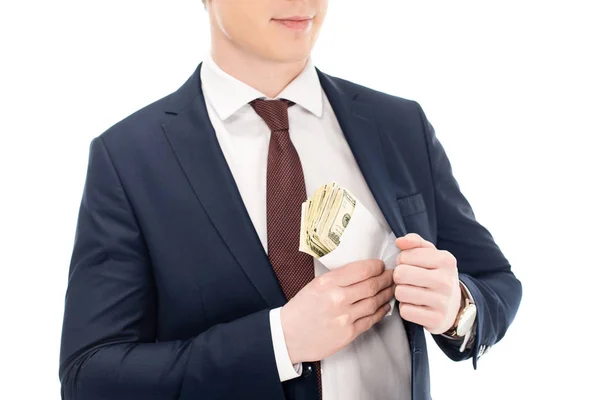 Cropped view of businessman putting bribe into pocket isolated on white — Stock Photo