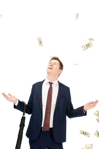 Successful businessman with falling dollar banknotes isolated on white — Stock Photo