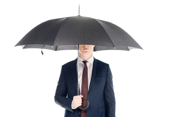 Homem de negócios elegante com rosto obscuro segurando guarda-chuva isolado no branco — Fotografia de Stock