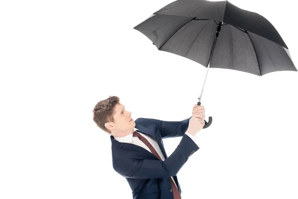 Stylish young businessman holding umbrella isolated on white — Stock Photo