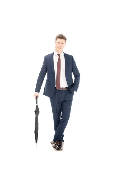 Stylischer Geschäftsmann posiert mit Regenschirm auf weißem Grund — Stockfoto