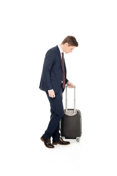 Stylish young businessman with suitcase for business trip, isolated on white — Stock Photo