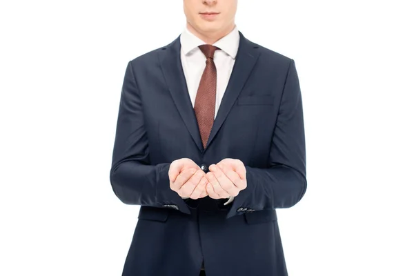 Cropped view of businessman holding something in palms isolated on white — Stock Photo