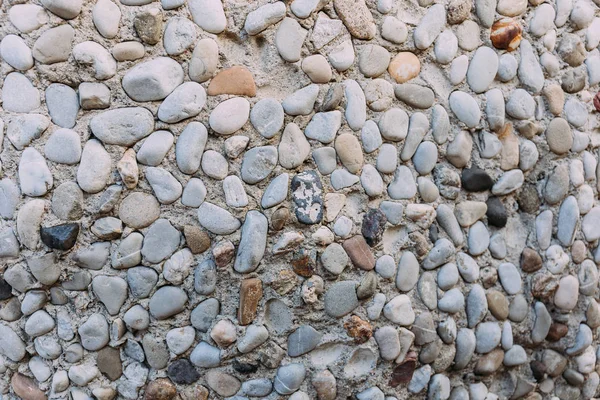 Mehrfarbige handarbeit texturierte steinwand, barcelona, spanien — Stockfoto