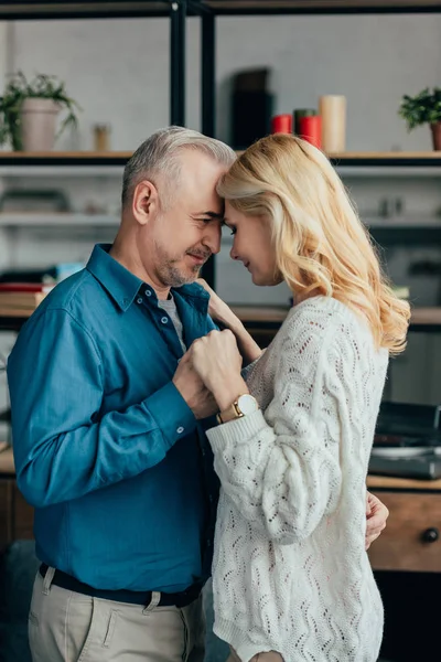 Happy husband and wife dancing at home — Stock Photo